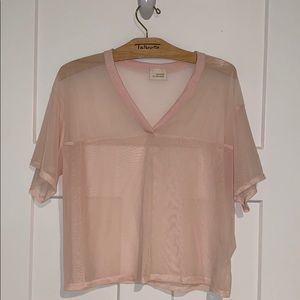 A cute light pink mesh-see-through shirt
